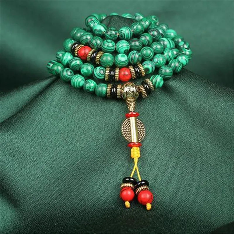Bracelet malachite 108 perles quelques perles rouges