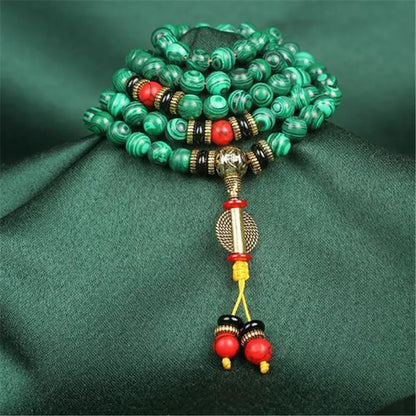 Bracelet malachite 108 perles quelques perles rouges