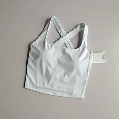 Brassière longue femme blanche à plat, vue de face avec coupe près du corps
