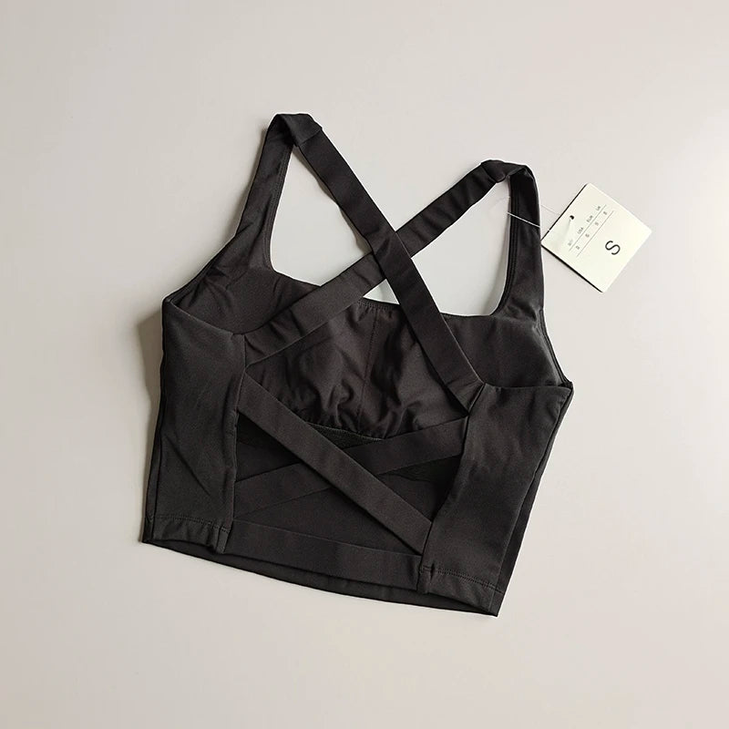 Brassière longue femme noire à plat, vue du dos avec bretelles et bandes croisées