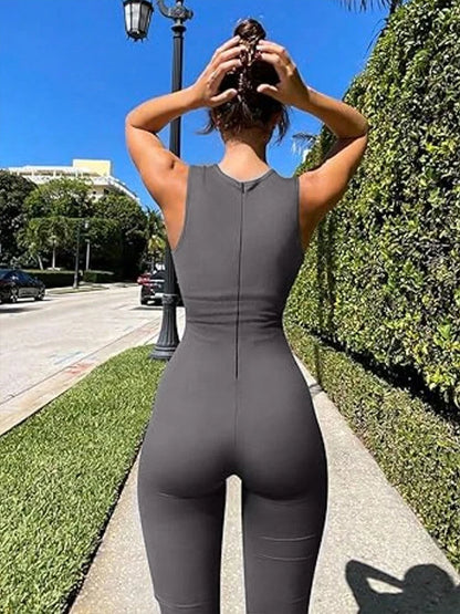 Combi legging évasée gris foncé sans manche portée par une femme vue de derrière fermeture claire