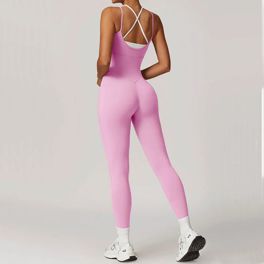 Combinaison fitness dos croisé vue arrière maintien épaules rose et blanche