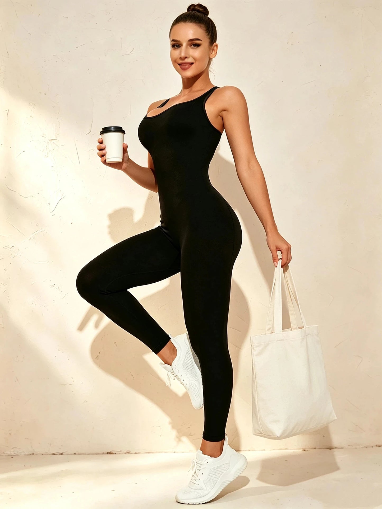 Combinaison leggings noire pour femme adaptée au sport et au fitness