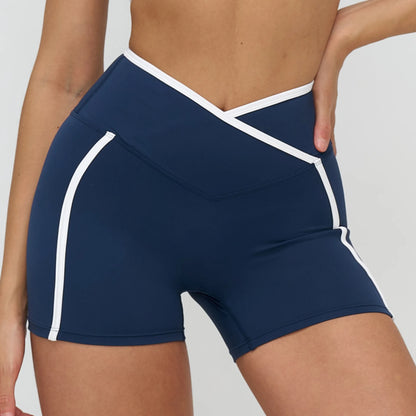 Short yoga femme bleu marine ligne blanche sport