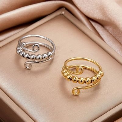 Bague anti stress femme argentée ou dorée perles rotatives