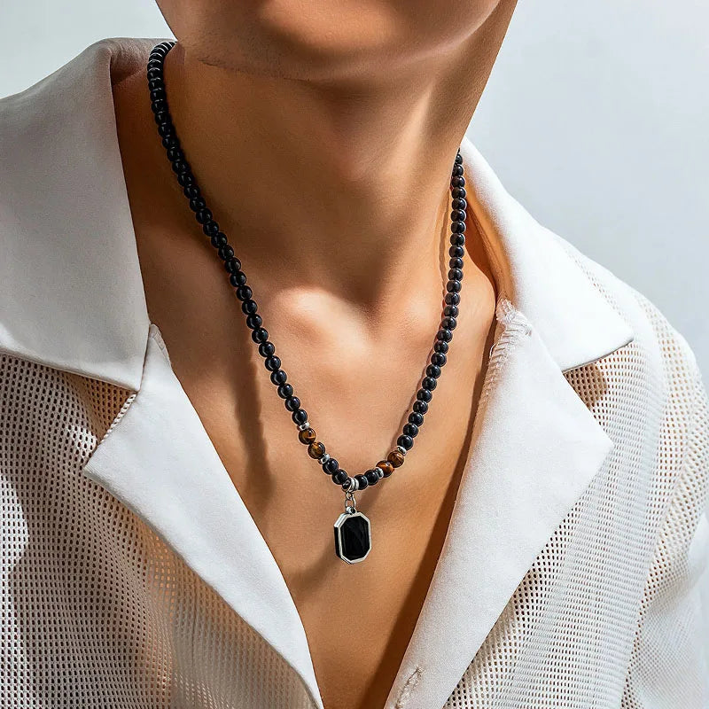 Collier de perles naturelles oeil de tigre et noires pendentif rectangle pierre noire homme