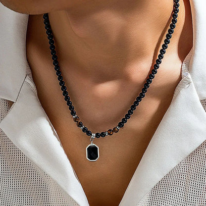 Collier de perles naturelles oeil de tigre et noir pendentif rectangle pierre noire