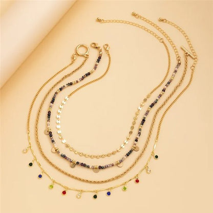 collier femme 4 pièces superposés multi rangs doré multicolores fantaisie classe chic élégant
