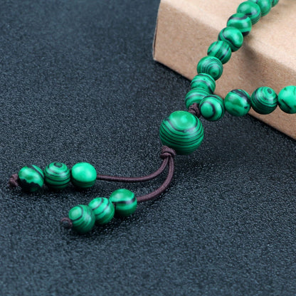 Collier perle malachite support bois  – pierre protectrice