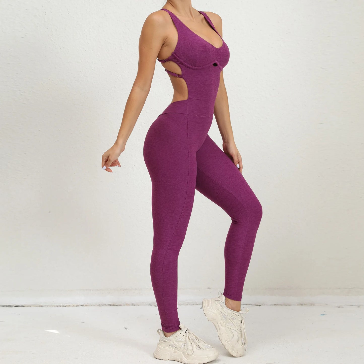 Combi sport femme violette silhouette gainante bretelles taille croisées