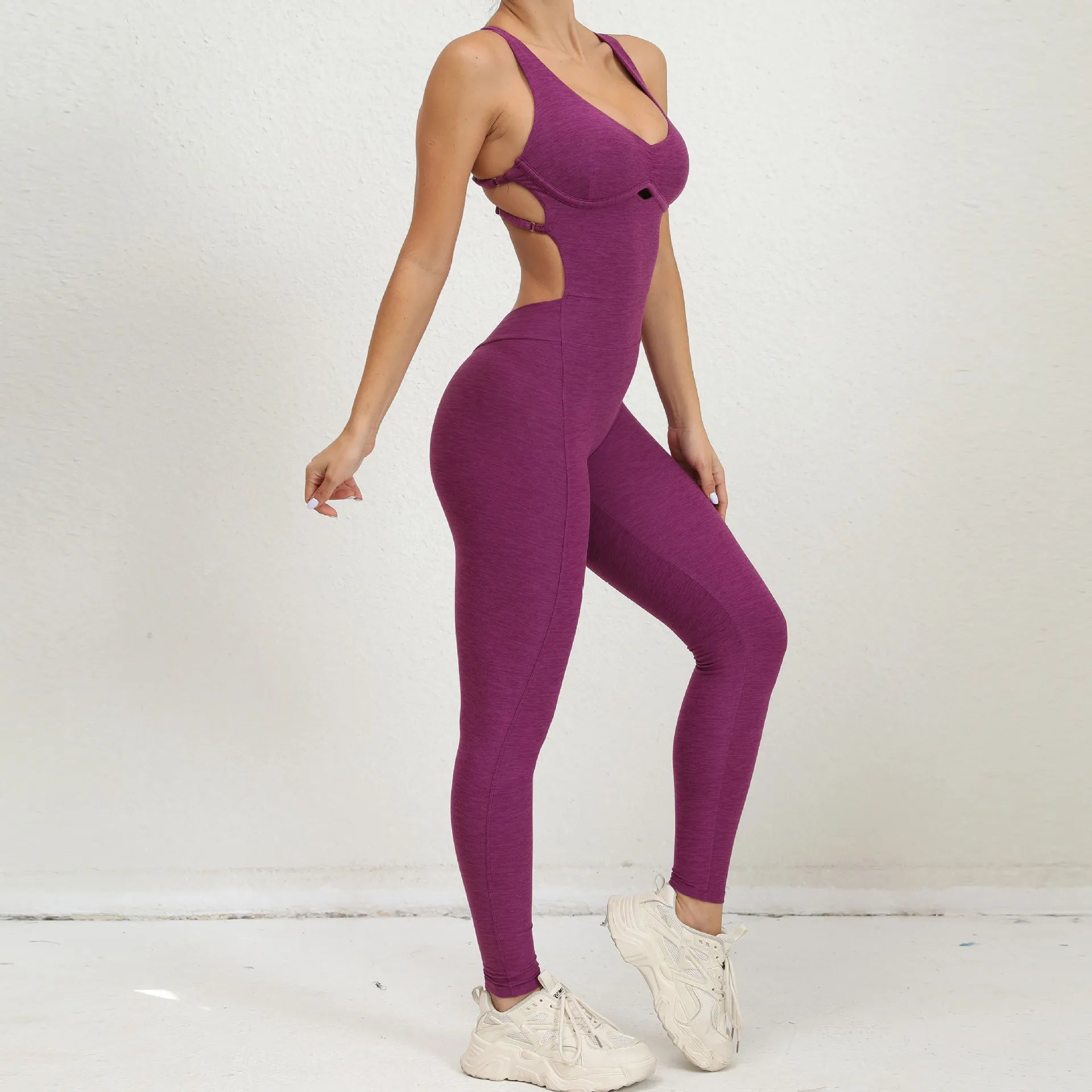 Combi sport femme violette silhouette gainante bretelles taille croisées