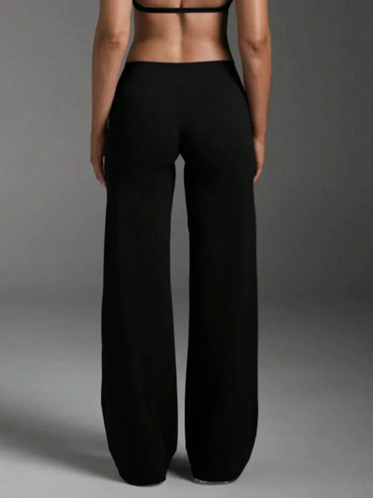 LEGGING SPORT EVASE femme vu de derrière – silhouette allongée