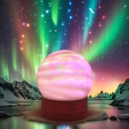 Projecteur aurore boréale LED créant des effets lumineux vert bleus rose dans un paysage nordique de montagnes enneigées