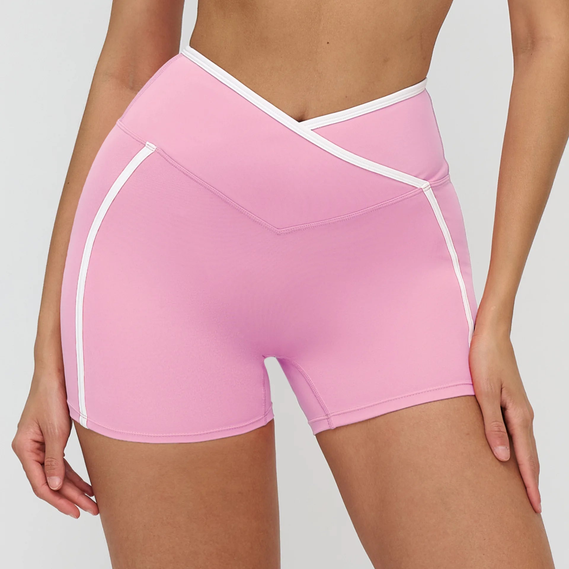 Short yoga rose femme coutures blanches sport